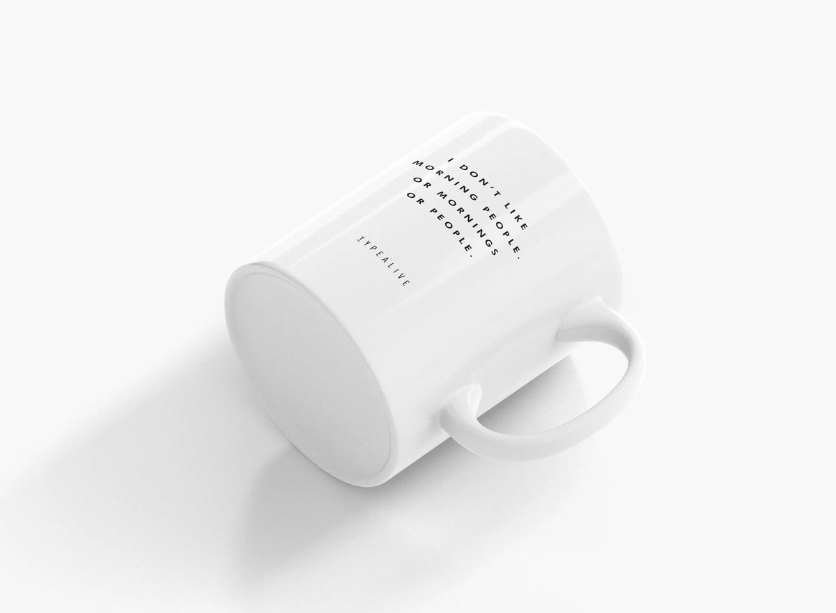 Morning People mug in white, seen from above resting on its side with the handle visible.