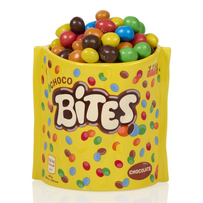 Choco Bites vase in yellow with colourful dots, filled with chocolate-coated sweets.