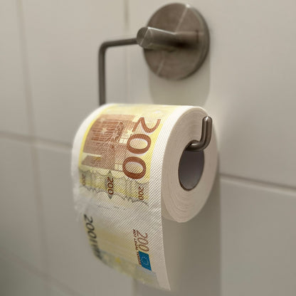 Toilet paper roll printed like a 200-euro banknote, hanging on the wall