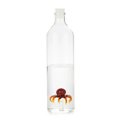 Atlantis Octopus bottle filled with water, on an orange background