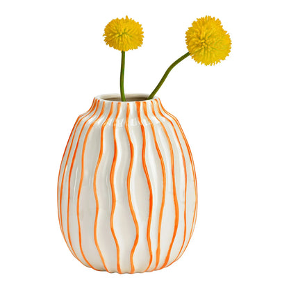 Waves vase in white with two yellow pompom flowers placed inside.