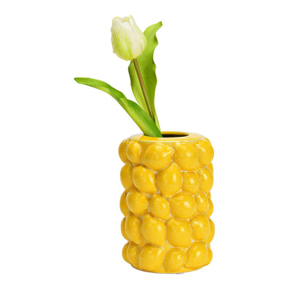 Zest vase in yellow with a white tulip placed inside.