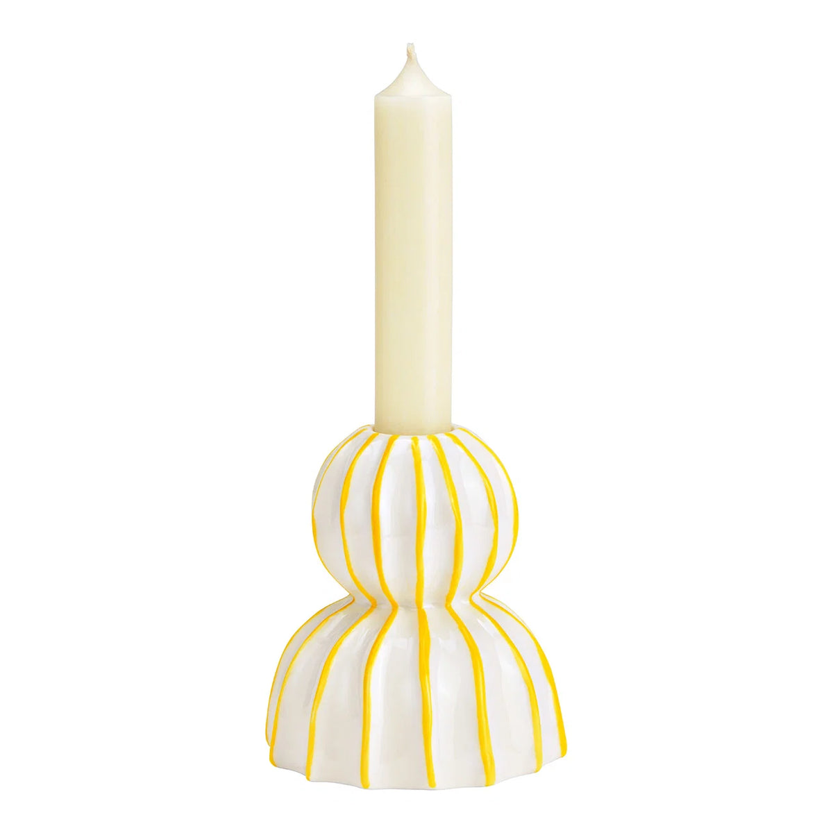 The Sole candlestick shown from a slightly different angle, with the same cream candle.