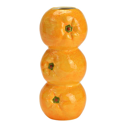 Oranges vase: three orange spheres stacked to look like oranges, empty.