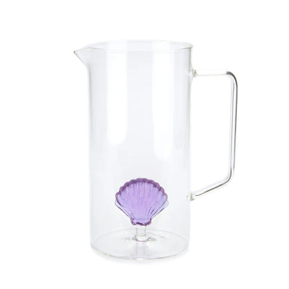 Atlantis jug in clear glass with a small decorative purple shell at the base.