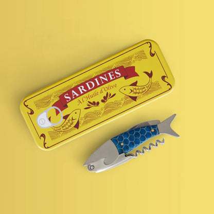 Sardines corkscrew shaped like a fish and its yellow tin box, seen from above.