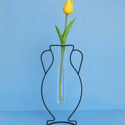 Hellas Silhouette vase, a black wire amphora outline, with a yellow tulip on a blue background