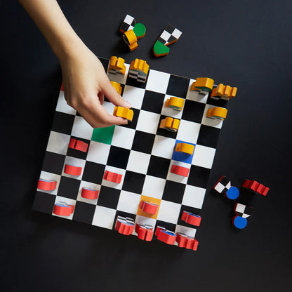 Hey Chess packaging with the black, white, red and green checkered board on the cover.