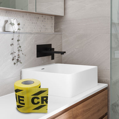 The striped toilet paper roll resting on the bathroom sink counter