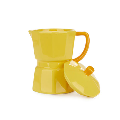 Yellow Moka mug on a white background with the lid resting beside it