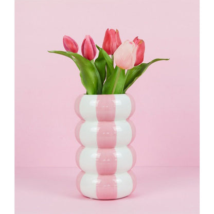 Pink and white Float Alto vase with pink tulips, on a pink background