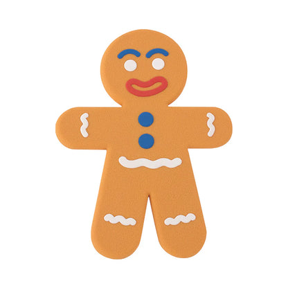Ginger Man trivet shaped like a gingerbread man, with white icing details and blue buttons.