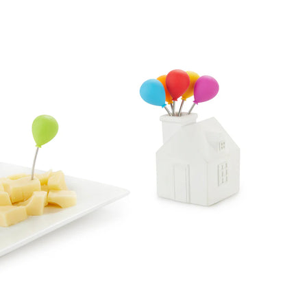 House Balloon snack forks holder on white, with balloon-topped forks and a plate of cheese.