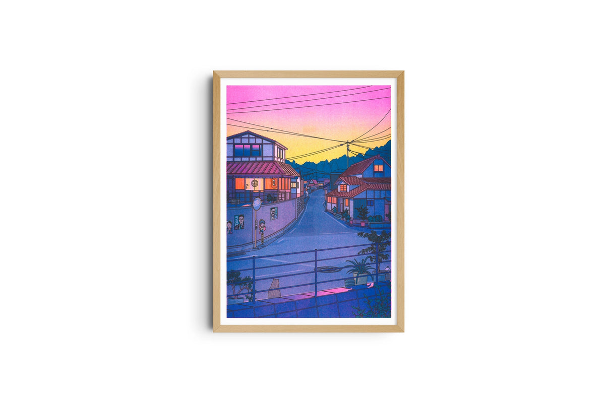 Nowhere in Japan poster shown full length in a light wood frame, a street at sunset