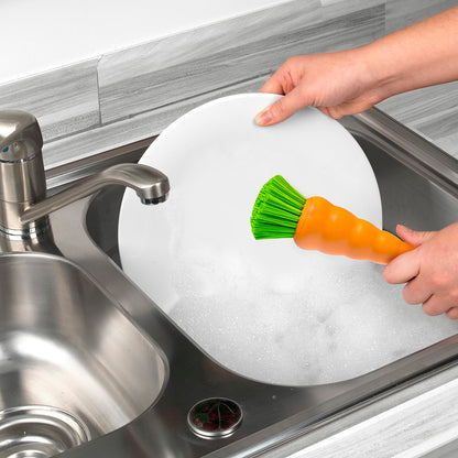 Bunny dish brush used to wash a plate in the sink
