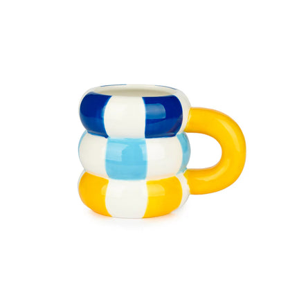 Mug made of stacked blue, white and yellow stripes, with an orange handle