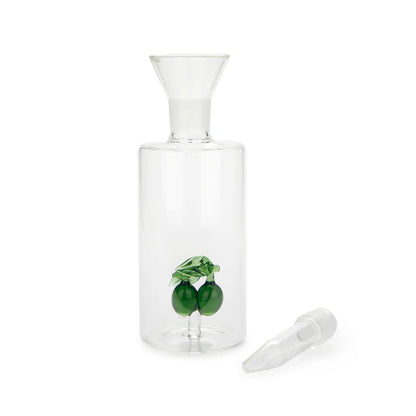 Olive oil cruet without its spout, with the white stopper resting beside it