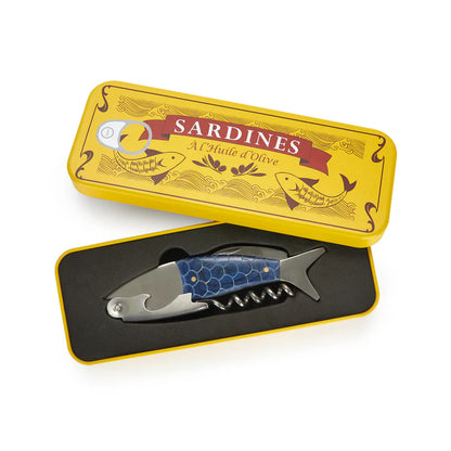 Sardines corkscrew shaped like a fish with a blue scale pattern, inside its yellow tin box.