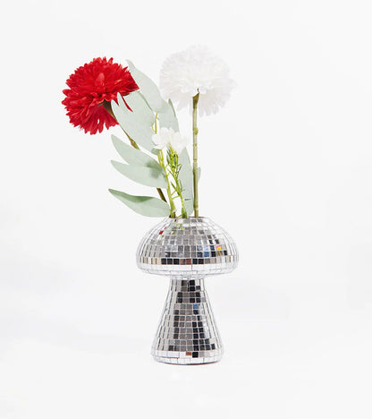 Small mirrored mushroom-shaped vase, holding red and white flowers