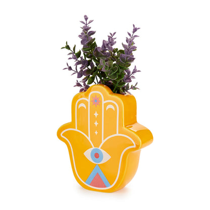 Yellow Lucky Hand vase with purple leaves on a white background