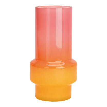 Glow vase in pink-to-orange ombre glass, cylindrical shape on a stepped base, empty.