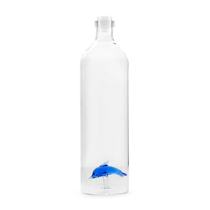 Clear glass bottle with a blue dolphin detail at the base