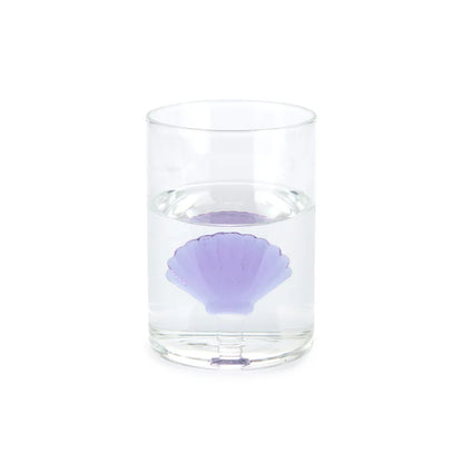 Atlantis Shell glass filled with water, the lilac shell visible inside