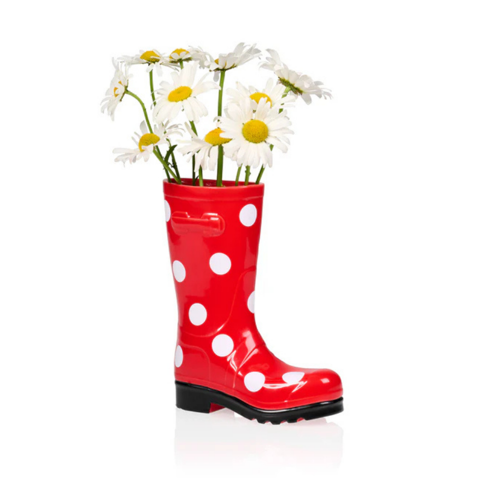 The polka-dot boot vase empty, without flowers, on a white background.