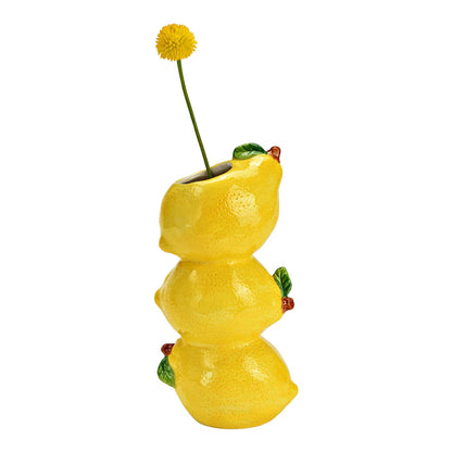 Amalfi Lemons vase in yellow with a yellow pompom flower placed on top.