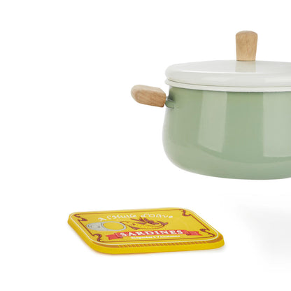 Sardines Trivet: the green pot on the kitchen counter next to the sardine-print trivet.