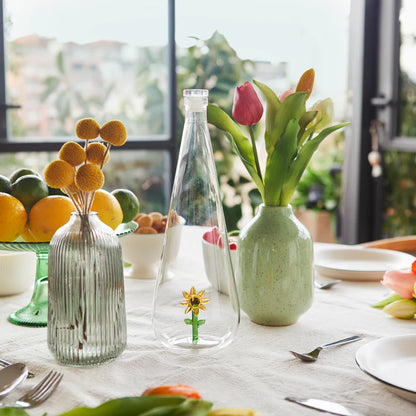 Botanical Sunflower 1L bottle on a set table with fruit and other vases