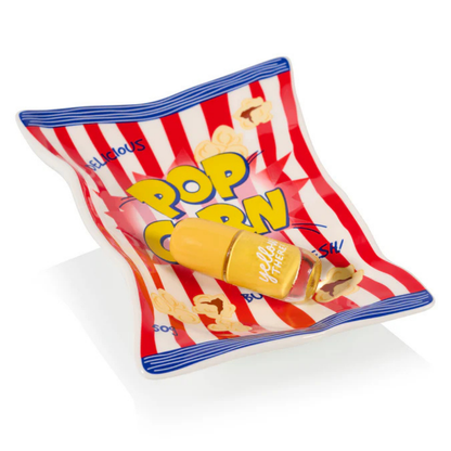 Il vassoio Pop Corn con un vasetto di miele a forma di pannocchia gialla appoggiato sopra.