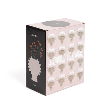 Lion vase, closed pink box seen side-on with a printed illustration of flowers and vases