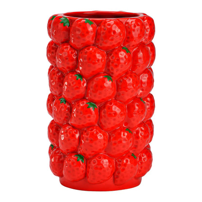 Strawberries vase in red, cylindrical, with a raised strawberry-textured surface, empty.