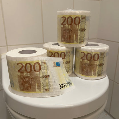 Several 200-euro banknote toilet paper rolls stacked on the toilet lid