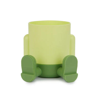 Mr.Sitty pen holder green pot seen from the front, empty on a white background.