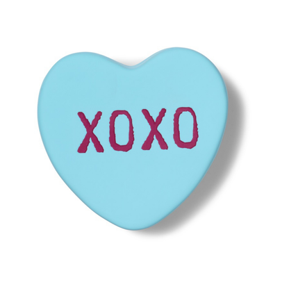 XOXO heart-shaped box in light blue, closed, front view with the purple lettering.