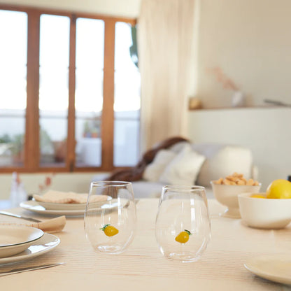 Botanical Lemon glass set on a set table with plates and fruit