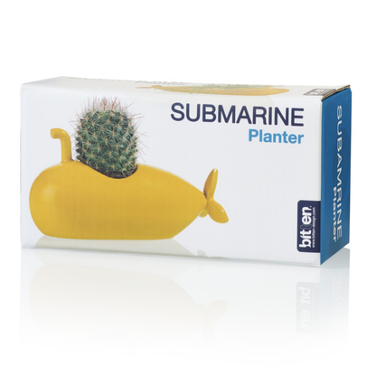 Yellow Submarine vase shown inside its blue and white retail box.