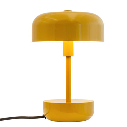 Haipot lamp in yellow, lit, alone on a white background.