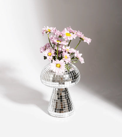 Small disco mushroom pot planted with pink daisies