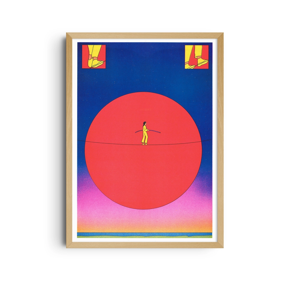 Framed poster of a figure balancing on a tightrope in front of a red sun