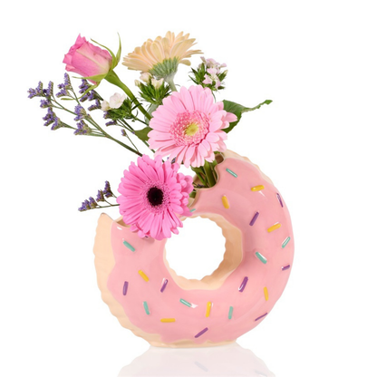Doughnut vase in pink with icing and sprinkles, styled with cut flowers.