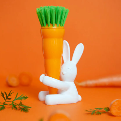 Bunny dish brush shaped like a carrot, hugged by the white rabbit