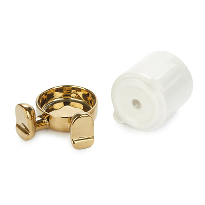 Mini Mr. Sitty Gold vase seen from below, gold base and white lid shown apart