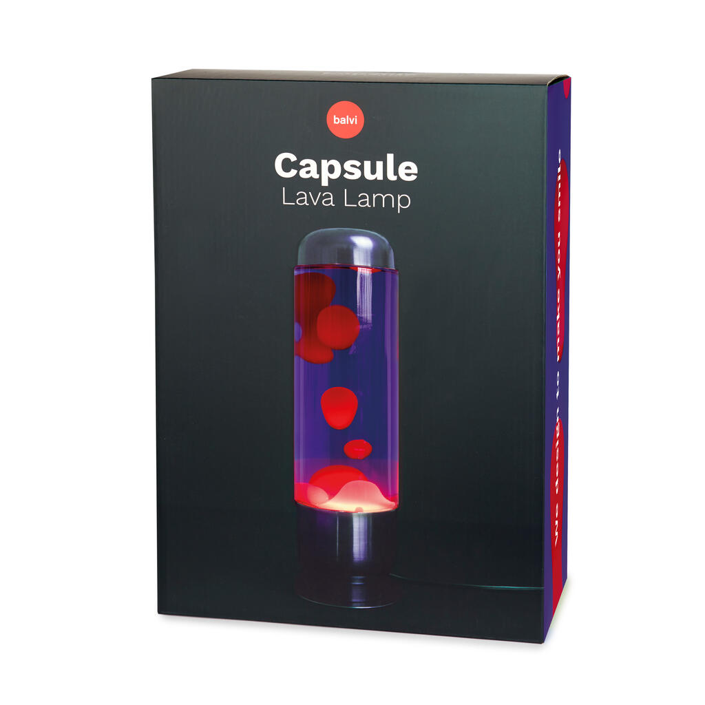 Lampada da Tavolo Lava Capsule: la confezione nera con la lampada accesa in foto.