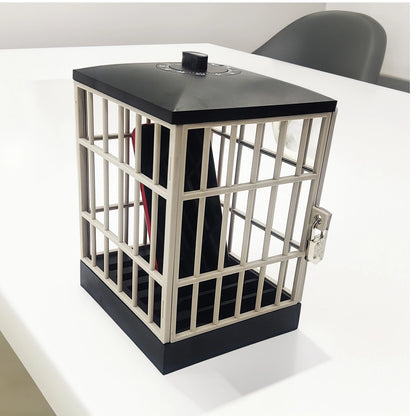 Phone Jail shown with the door open and the hinge visible, on a white table.