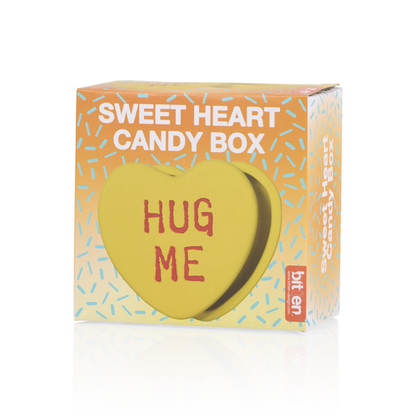 Hug Me heart box in yellow, in its candy-heart shaped packaging.