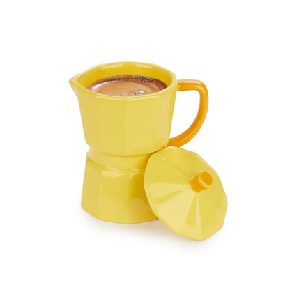 Yellow Moka mug filled with coffee, lid resting beside it