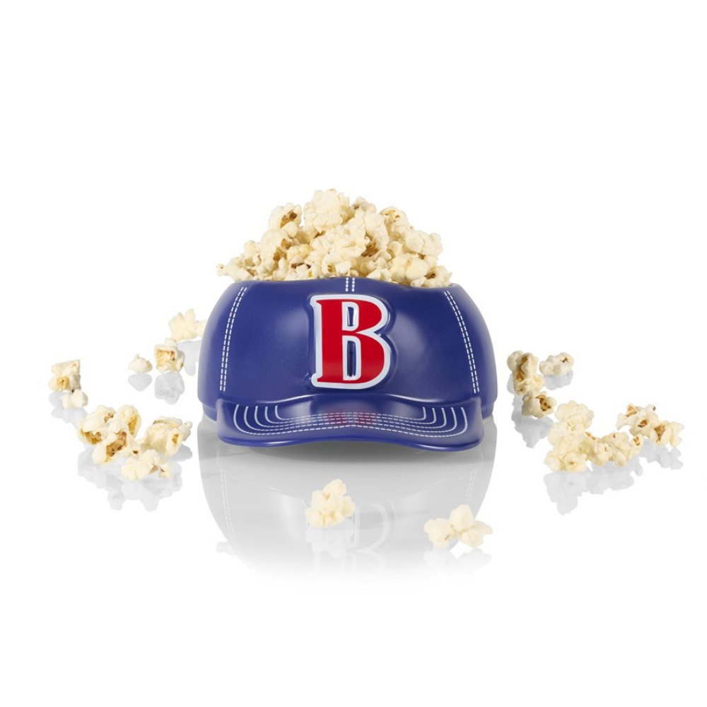 Baseball Cap bowl vase in blue, filled with popcorn.